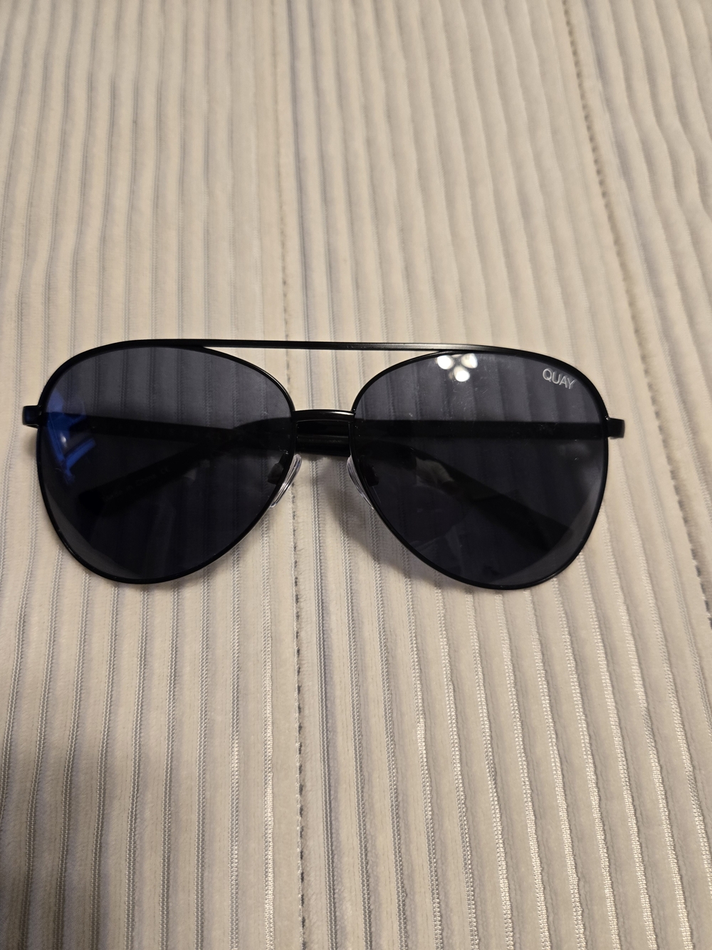 Quay Australia Vivienne aviator sunglasses in black with smoke lenses.